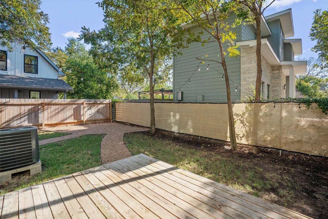 1209 Casey Street, Unit A Austin, TX 78745 - Photo 12 of 14 a view of a backyard with a house