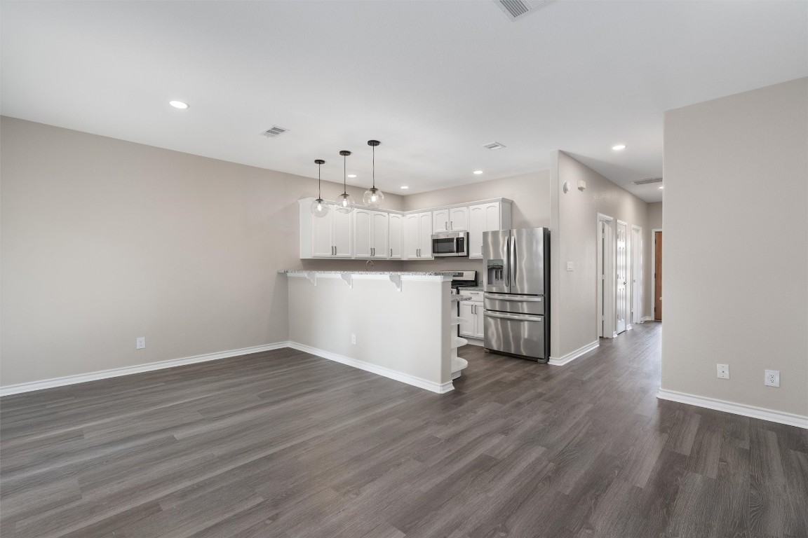 1209 Casey Street, Unit A Austin, TX 78745 - Photo 2 of 14 a view of a kitchen with a sink and wooden floor