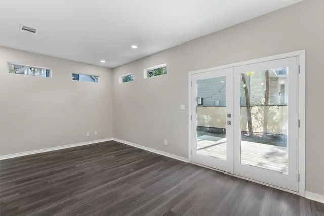 a view of wooden floor in an empty room