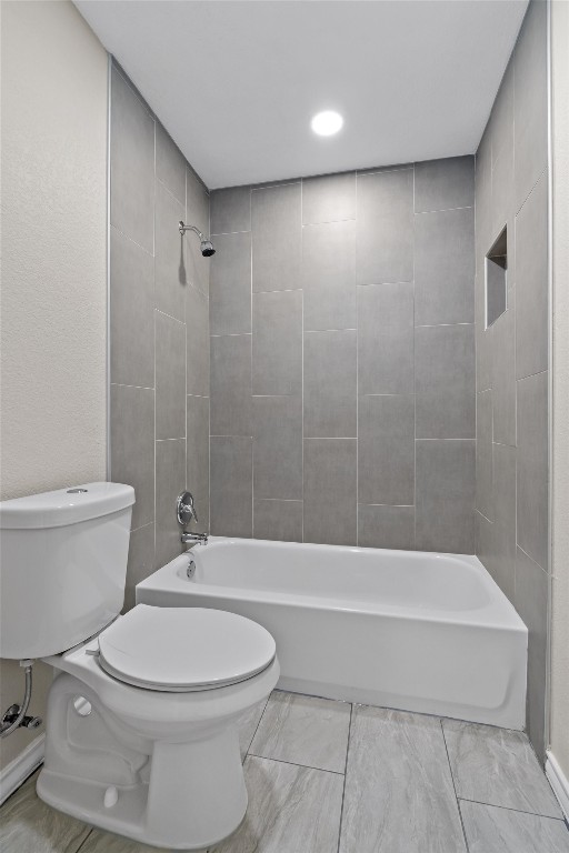1209 Casey Street, Unit A Austin, TX 78745 - Photo 10 of 14 a bathroom with a toilet a sink and bathtub