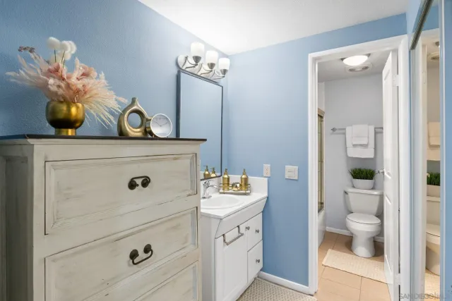 a bathroom with a double vanity sink and mirror