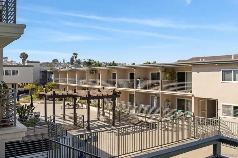 a view of a balcony with chairs