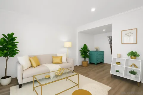 a living room with furniture and a potted plant