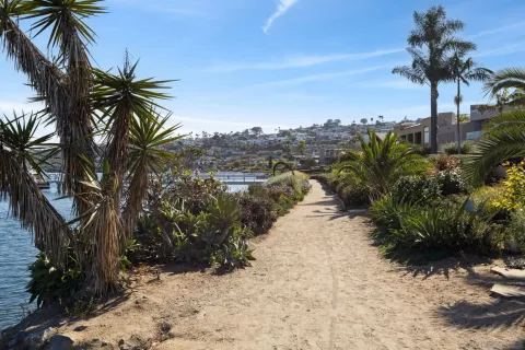 a view of swimming pool with table and chairs
