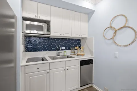 a kitchen with a sink and a microwave