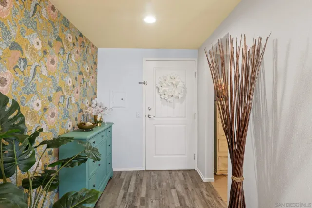 a view of front door with wooden floor