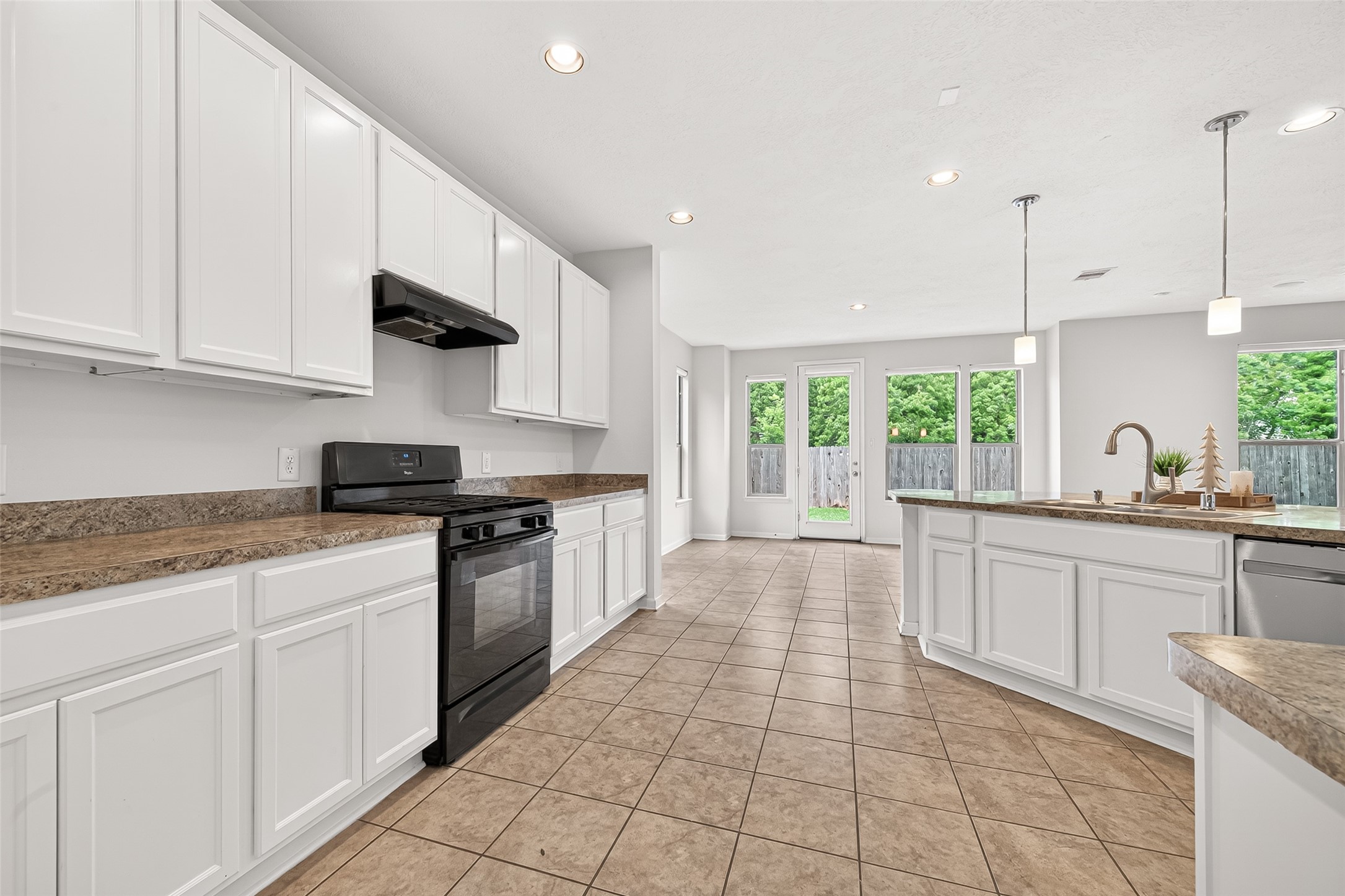 21454 Piralta Ridge Lane Katy, TX 77449 - Photo 13 of 33 a large kitchen with stainless steel appliances granite countertop a stove a sink and a granite counter tops