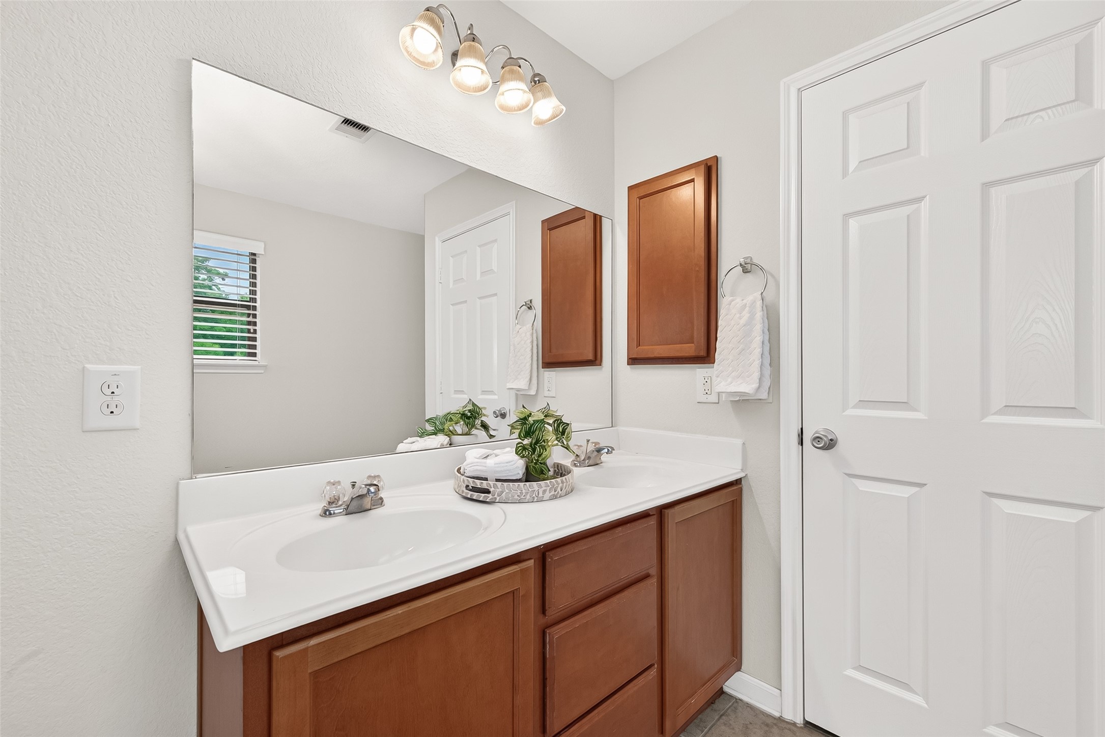 21454 Piralta Ridge Lane Katy, TX 77449 - Photo 21 of 33 a bathroom with a sink vanity and a mirror