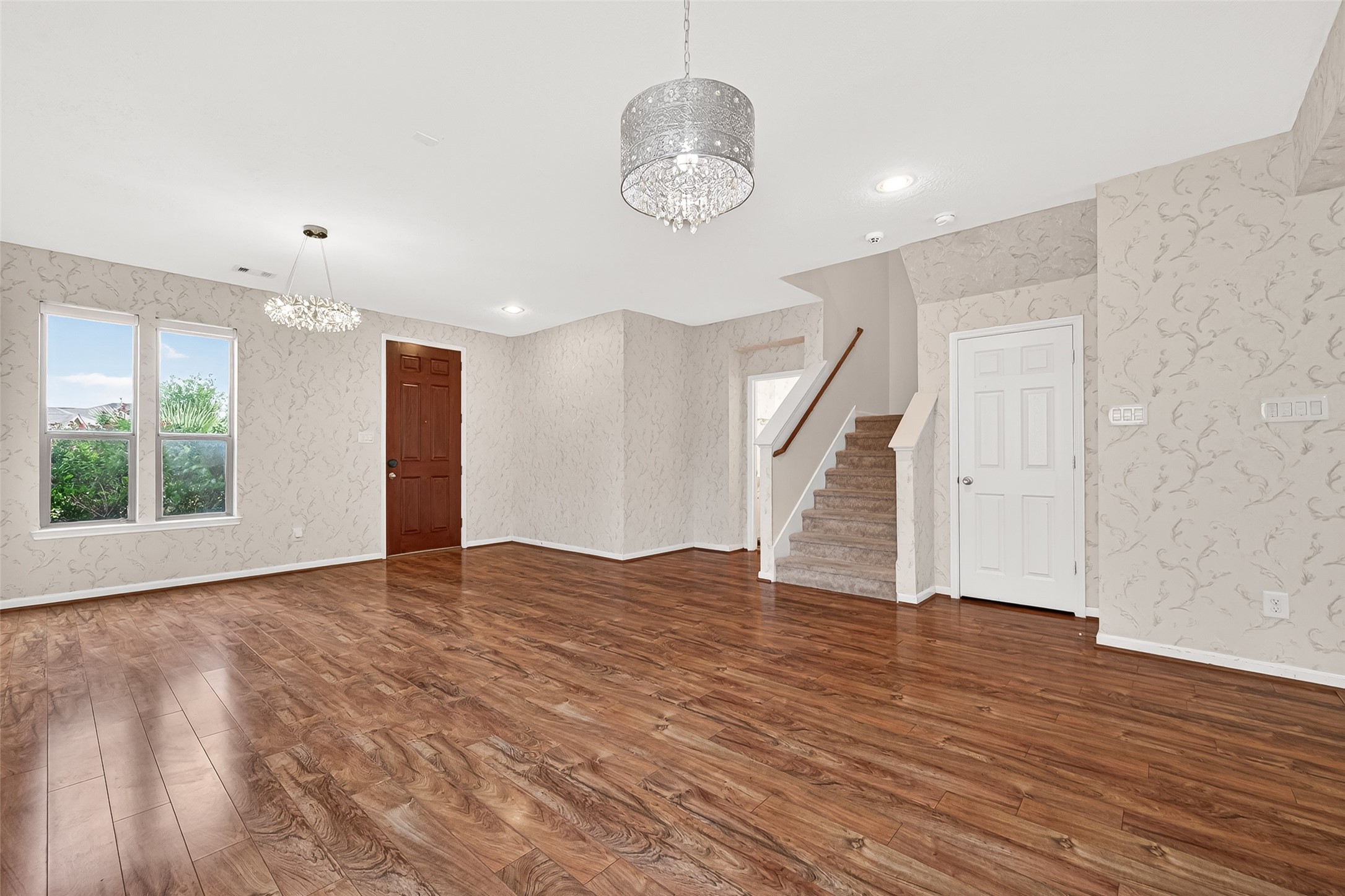 21454 Piralta Ridge Lane Katy, TX 77449 - Photo 3 of 33 a view of an empty room with wooden floor and a window