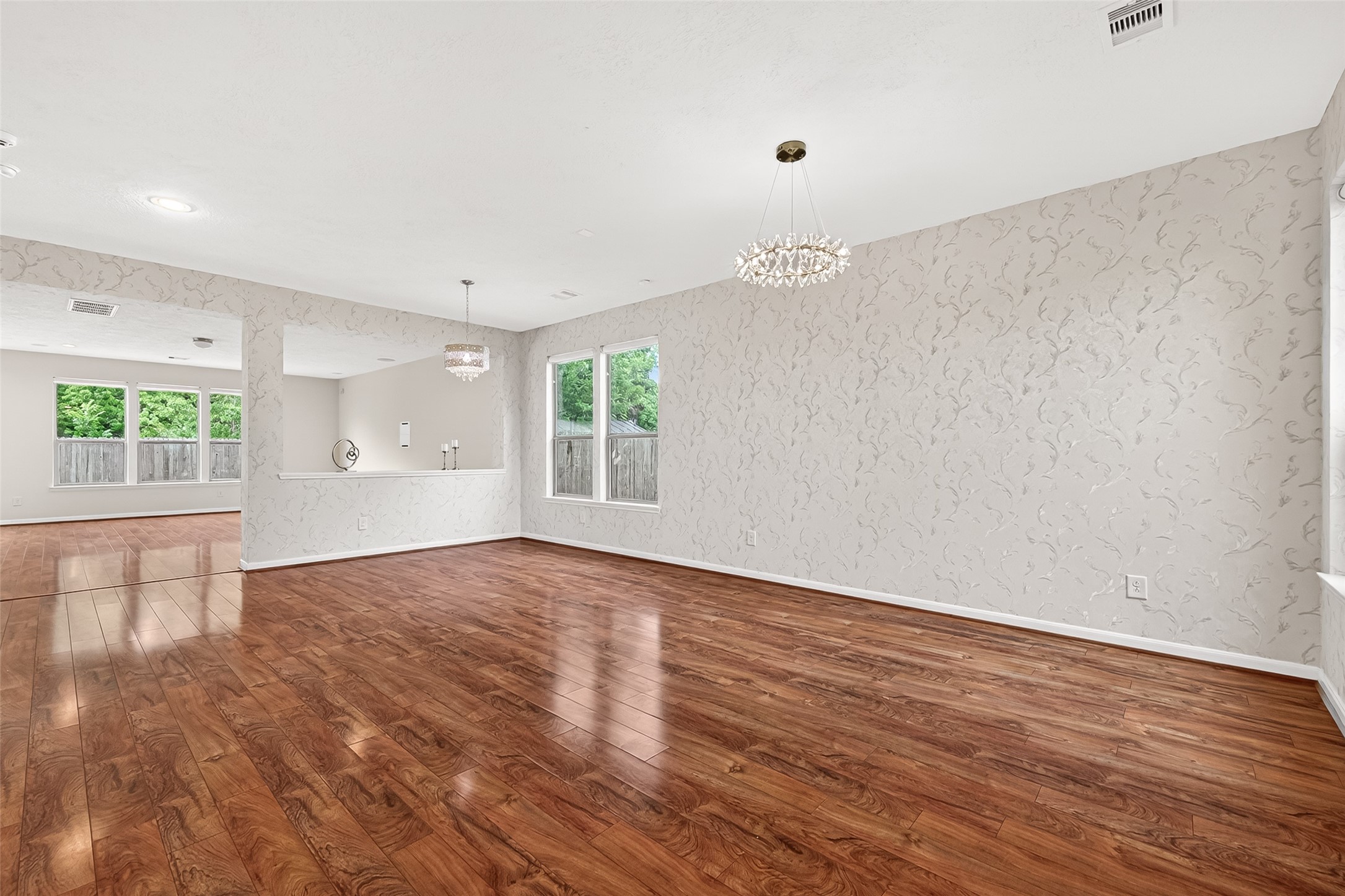 21454 Piralta Ridge Lane Katy, TX 77449 - Photo 5 of 33 an empty room with wooden floor and windows