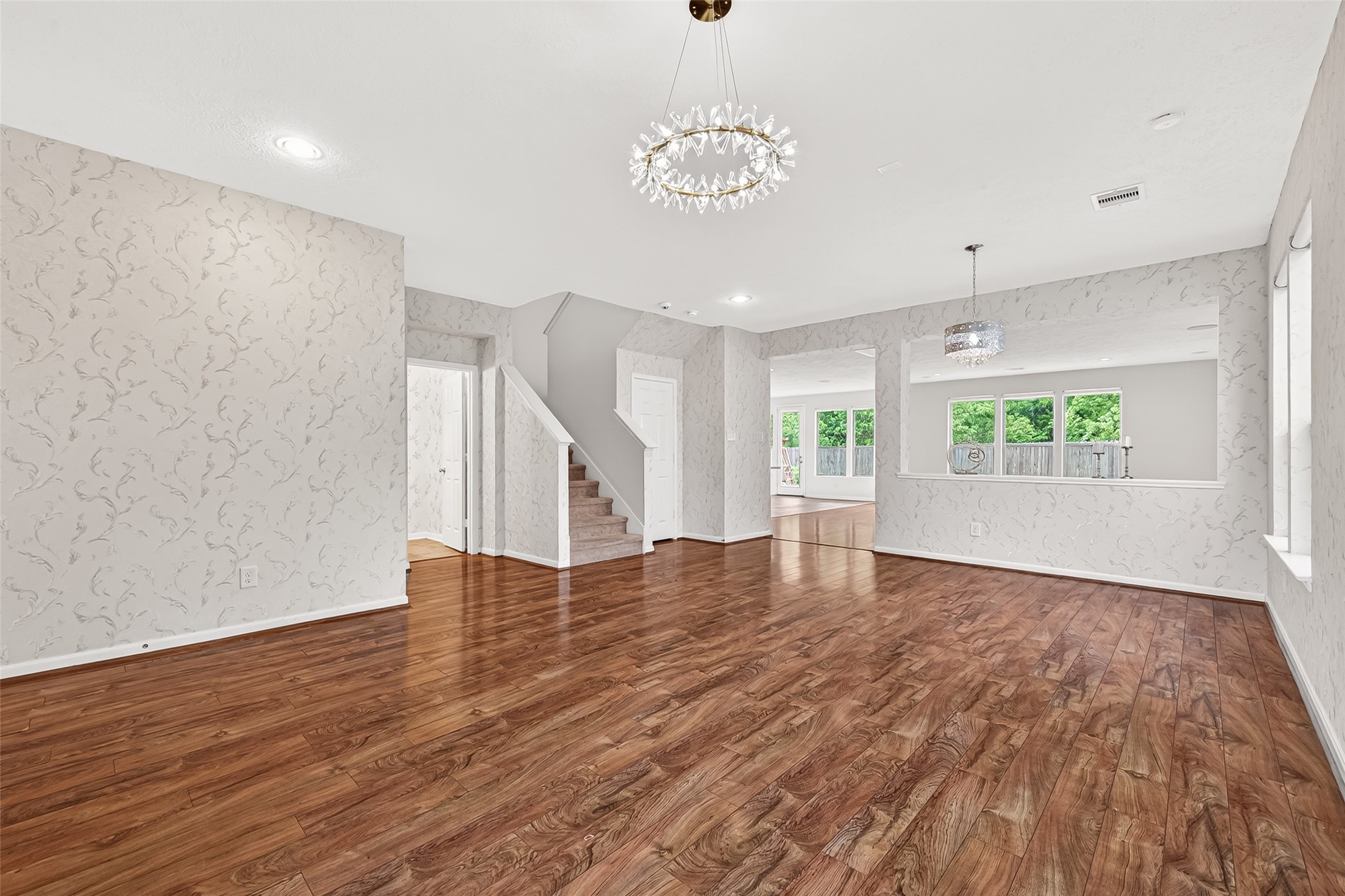 21454 Piralta Ridge Lane Katy, TX 77449 - Photo 6 of 33 an empty room with wooden floor and windows