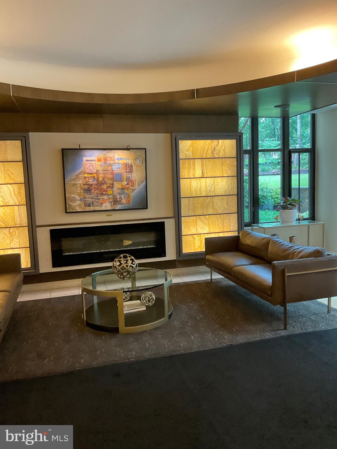 4301 Military Road Northwest, Unit 208 Washington, DC 20015 - Photo 19 of 32 a living room with furniture and a flat screen tv