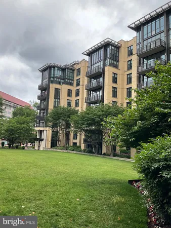 a view of a building with a yard