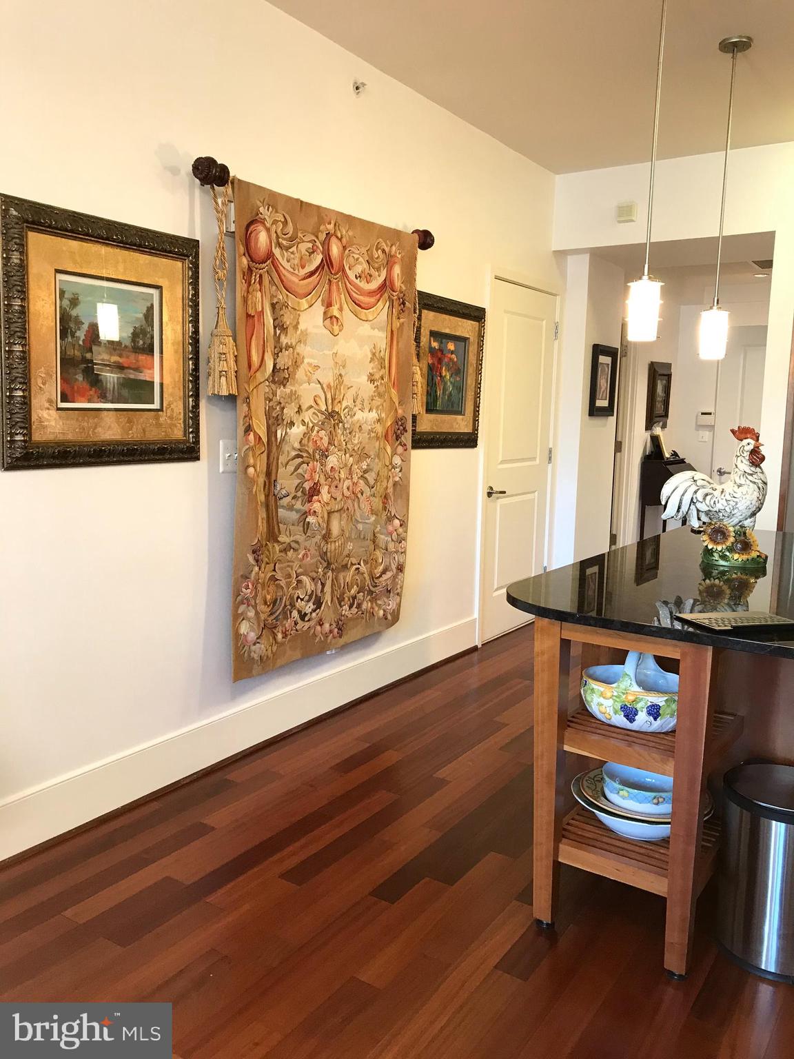 4301 Military Road Northwest, Unit 208 Washington, DC 20015 - Photo 8 of 32 a view of a workspace with furniture and wooden floor