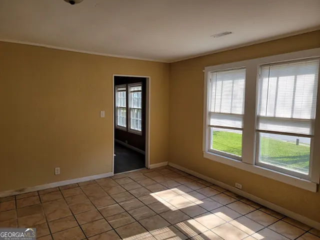 a bathroom with a toilet and a bathtub