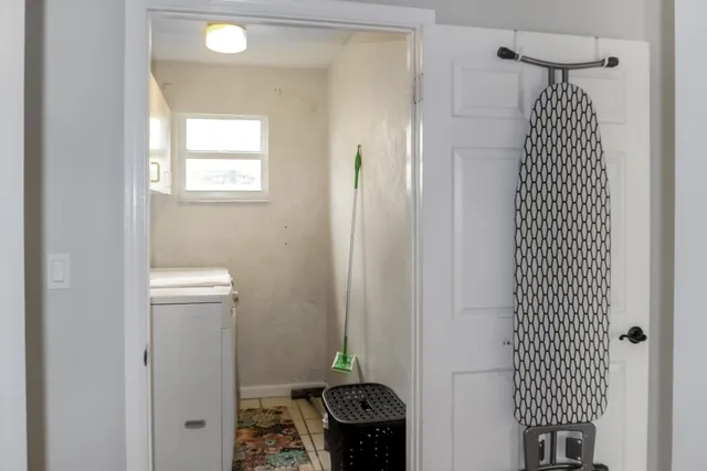 a bedroom with a bed and a mirror