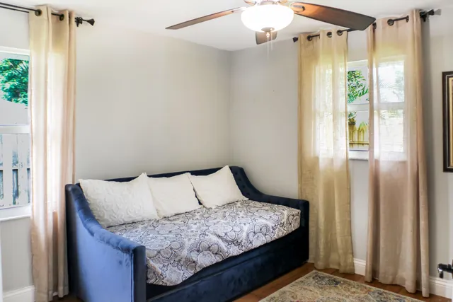 a bedroom with a bed and a window