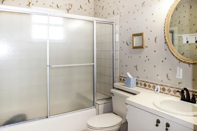 view of a hallway with wooden floor and dining room