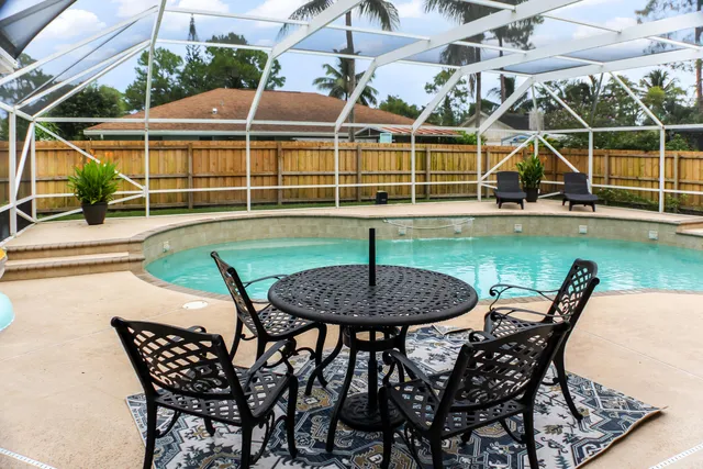 a building outdoor space with patio furniture and potted plants