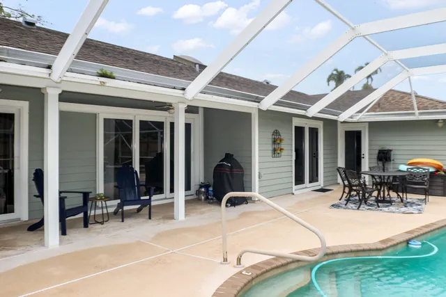 a view of a swimming pool with a bench