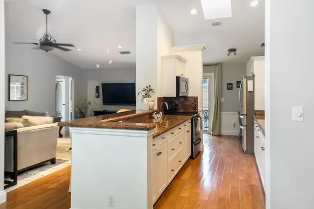 a spacious bathroom with double sink and a mirror