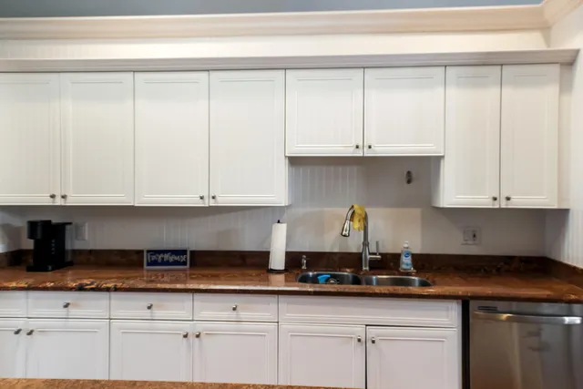 a kitchen with appliances cabinets and a counter top space