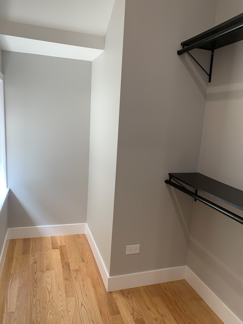 1303 West Flournoy Street, Unit 1F Chicago, IL 60607 - Photo 13 of 15 a view of a room with wooden floor