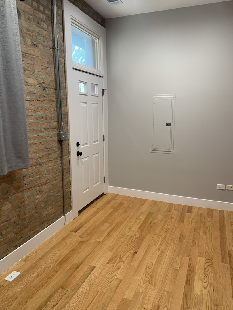 1303 West Flournoy Street, Unit 1F Chicago, IL 60607 - Photo 8 of 15 a view of an empty room