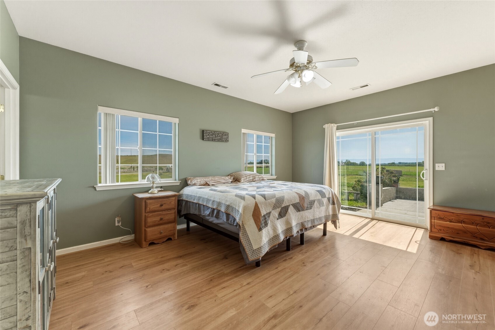 219 Reeds Road Touchet, WA 99360 - Photo 18 of 40 a bedroom with a bed and a large window