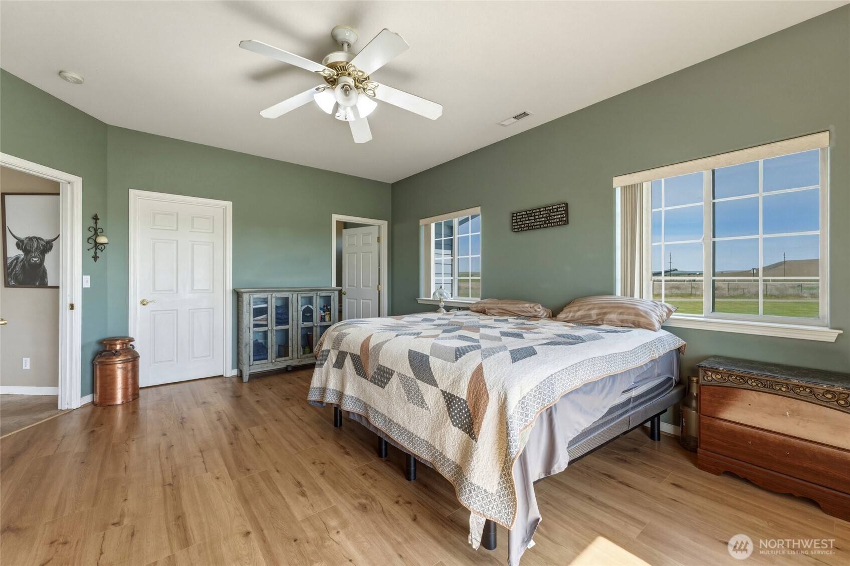 219 Reeds Road Touchet, WA 99360 - Photo 19 of 40 a spacious bedroom with a bed and a large window