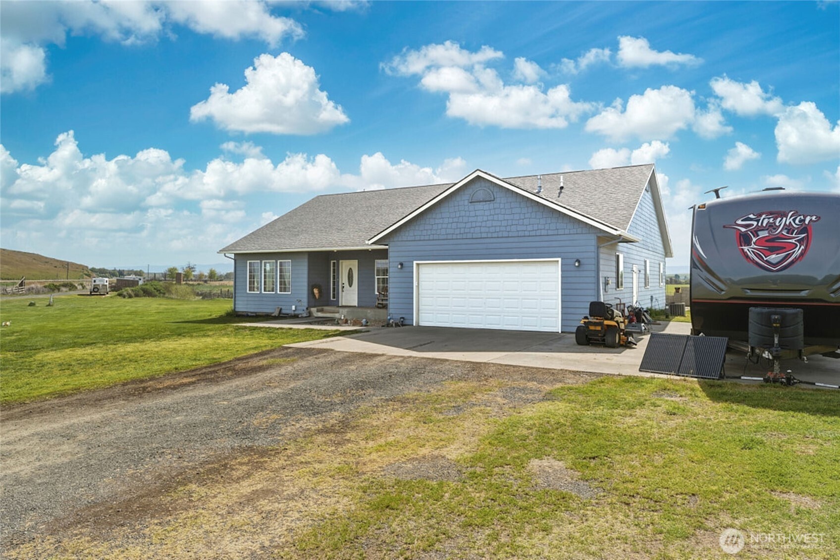 219 Reeds Road Touchet, WA 99360 - Photo 2 of 40 a view of a house with backyard and garden