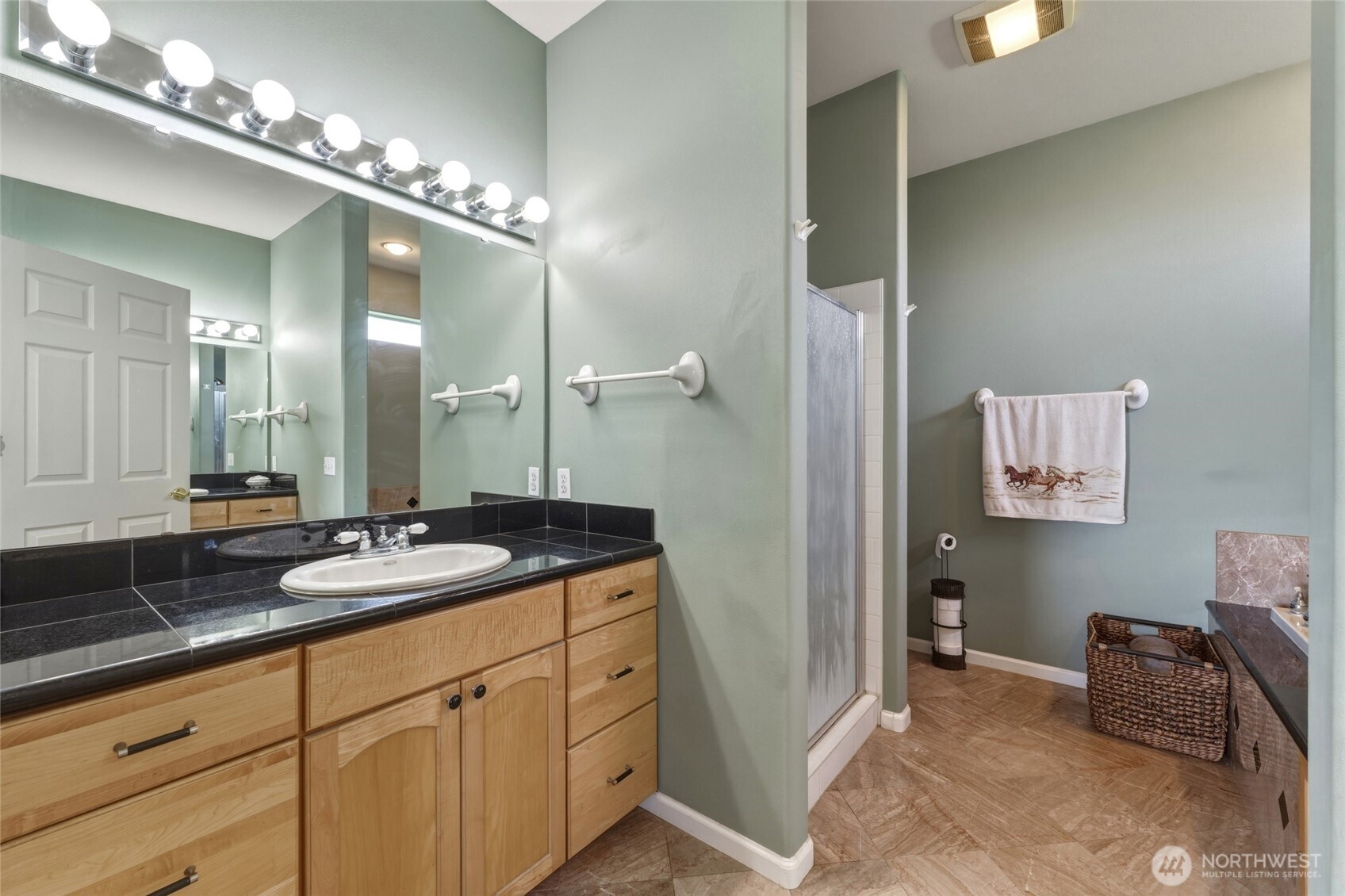 219 Reeds Road Touchet, WA 99360 - Photo 21 of 40 a spacious bathroom with a granite countertop sink a mirror and a shower