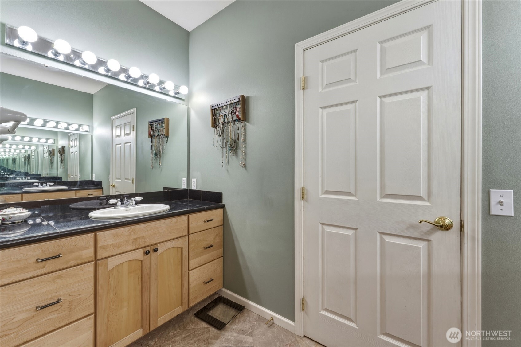 219 Reeds Road Touchet, WA 99360 - Photo 24 of 40 a bathroom with a double vanity sink and a mirror