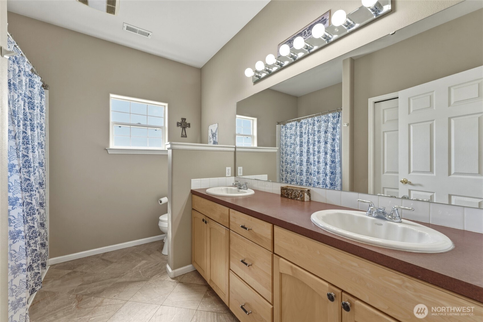 219 Reeds Road Touchet, WA 99360 - Photo 25 of 40 a bathroom with a sink double vanity and a mirror
