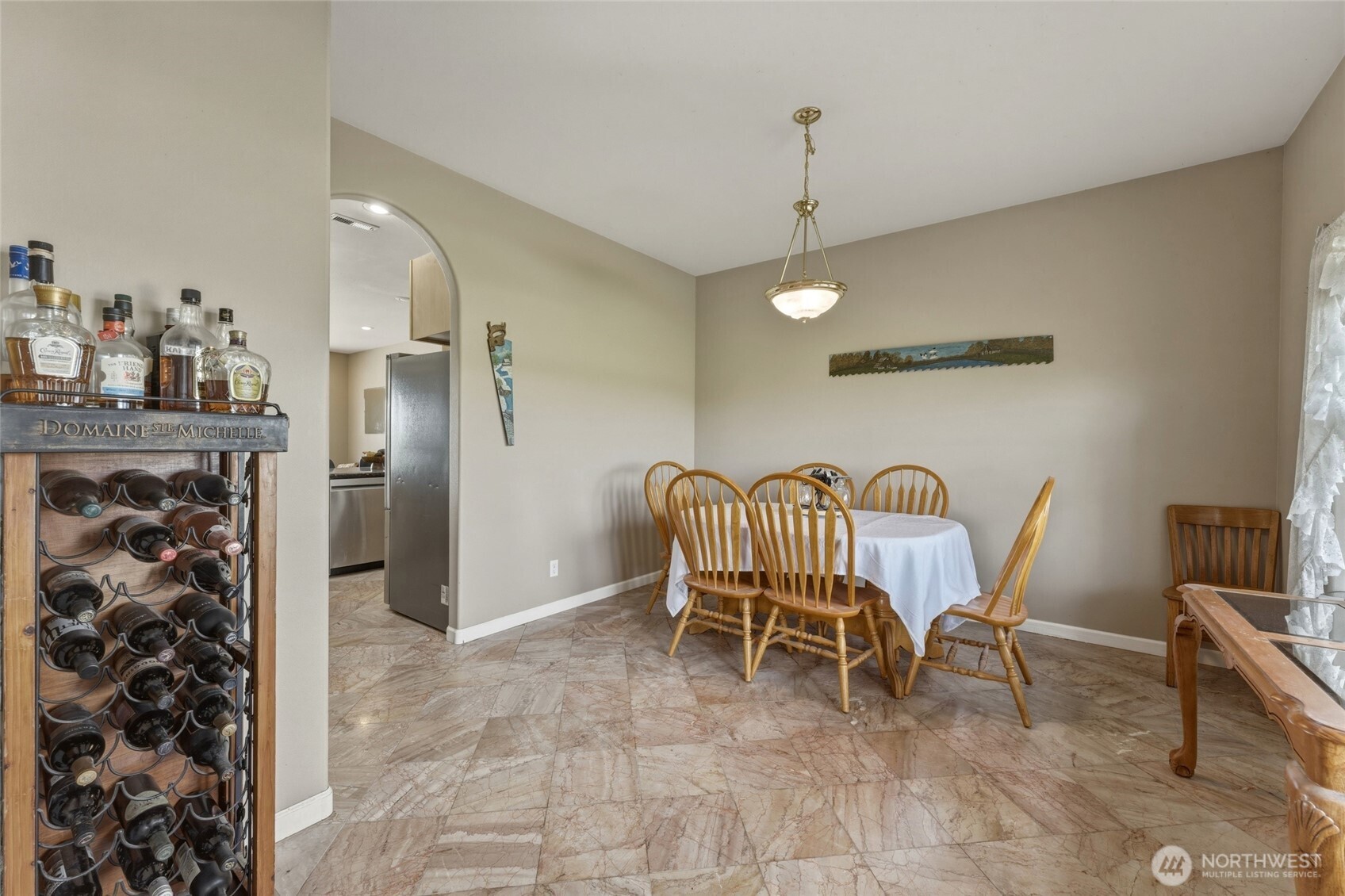 219 Reeds Road Touchet, WA 99360 - Photo 7 of 40 a dinning room with furniture and a chandelier