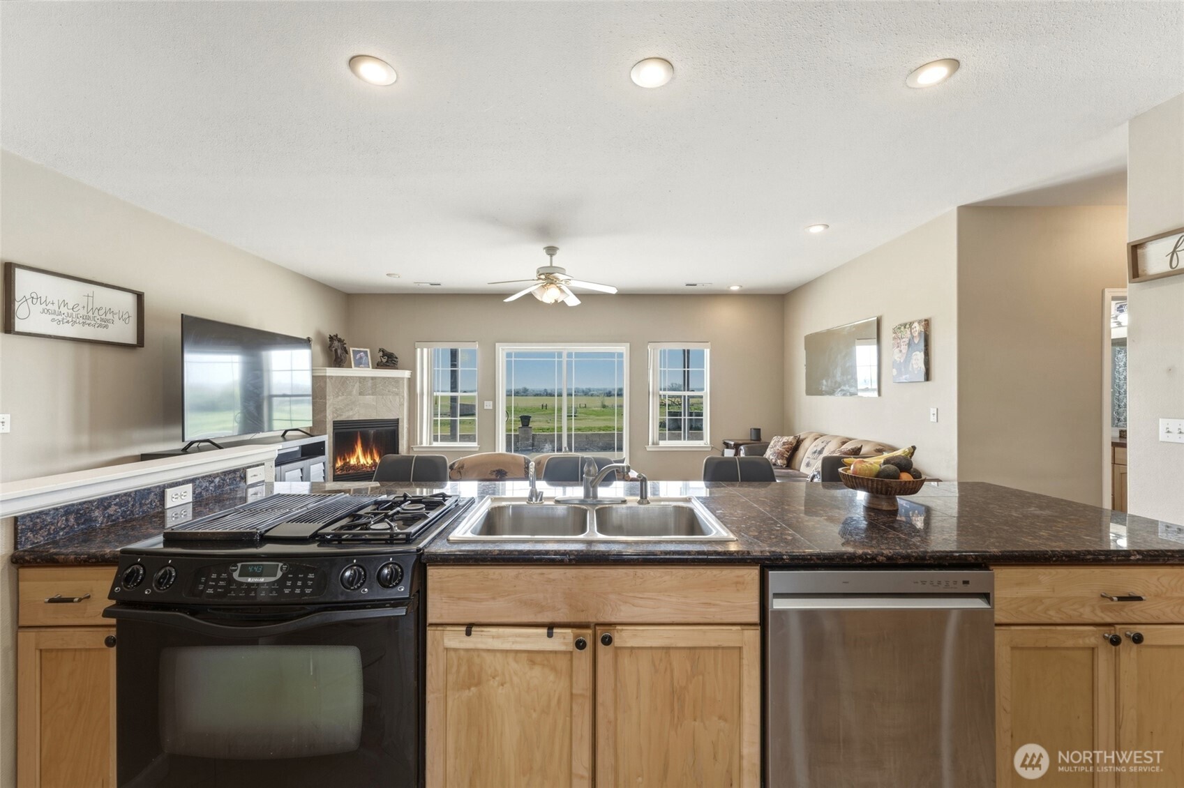 219 Reeds Road Touchet, WA 99360 - Photo 9 of 40 a kitchen with granite countertop a sink and a stove