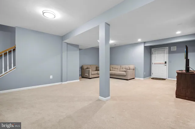 a bedroom with furniture and a chandelier