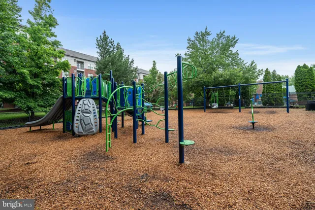 a view of a building with car parked