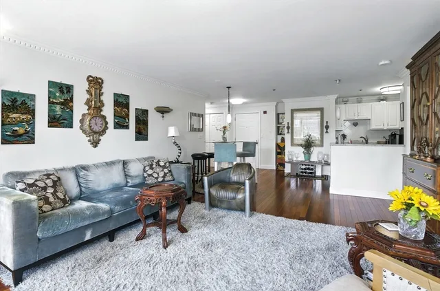 a living room with fireplace furniture and a flat screen tv