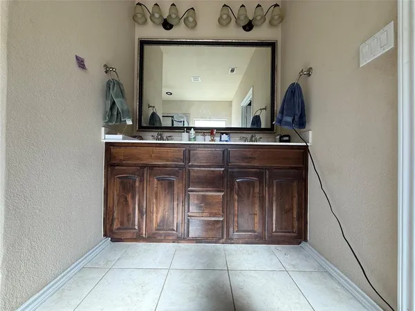 a kitchen with a stove and cabinets