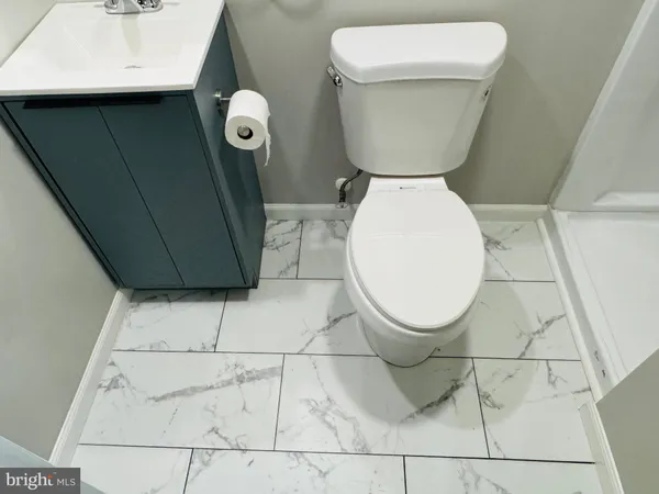 a bathroom with a sink and a toilet