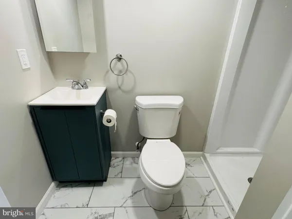 a bathroom with a toilet and a sink
