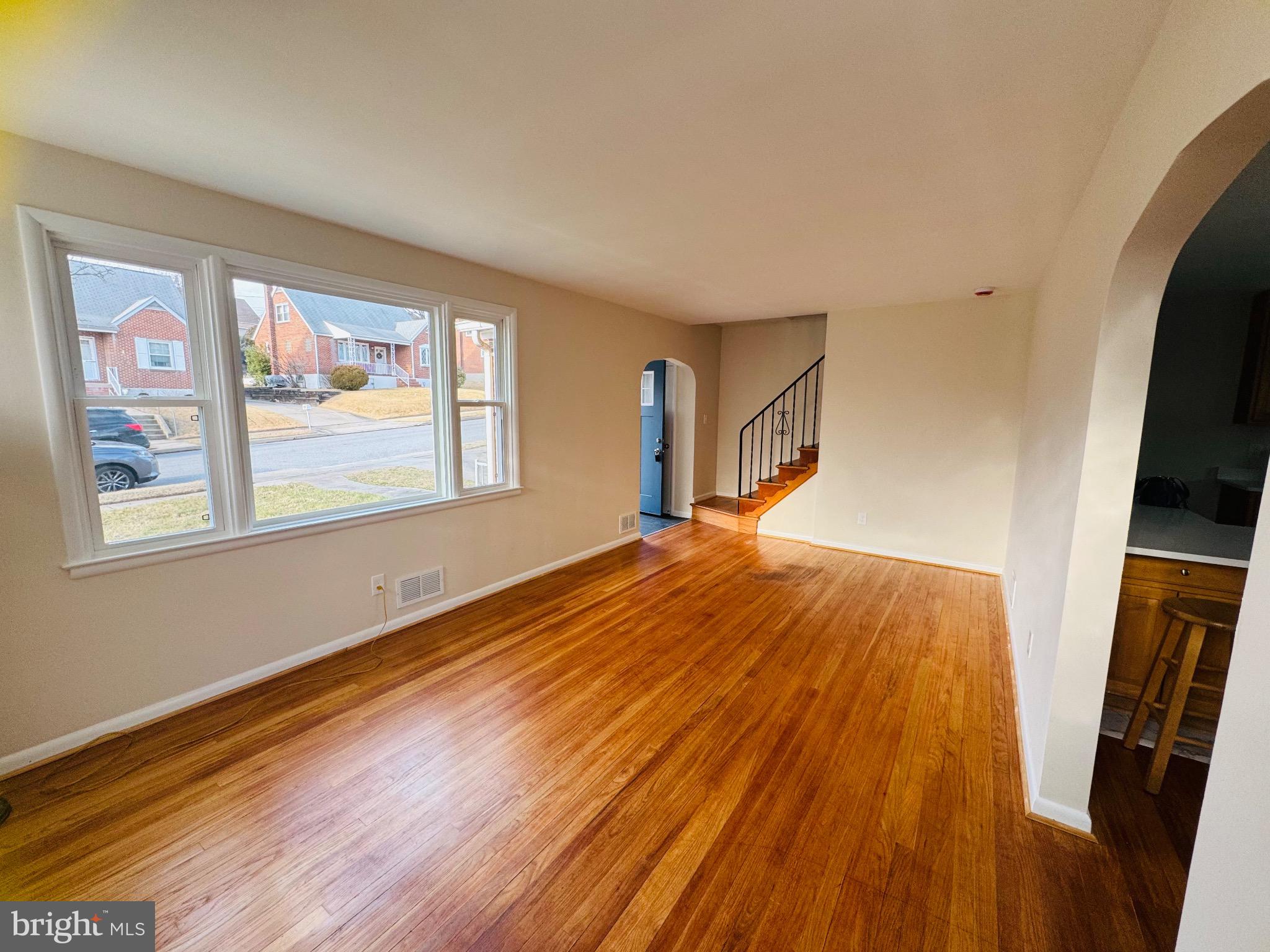 8111 Analee Avenue Rosedale, MD 21237 - Photo 7 of 23 Bright and airy living space with hardwood floors.