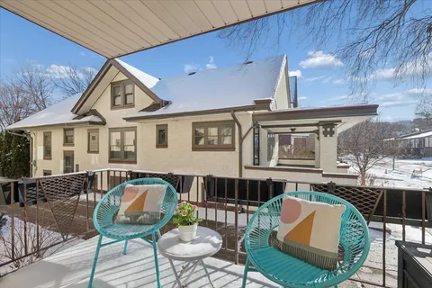 a kitchen with white cabinets sink and white appliances