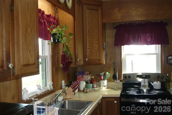 a kitchen with a sink and a stove