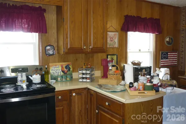 a kitchen with a sink cabinets and window