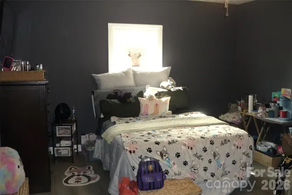 a bedroom with a bed and a table in it