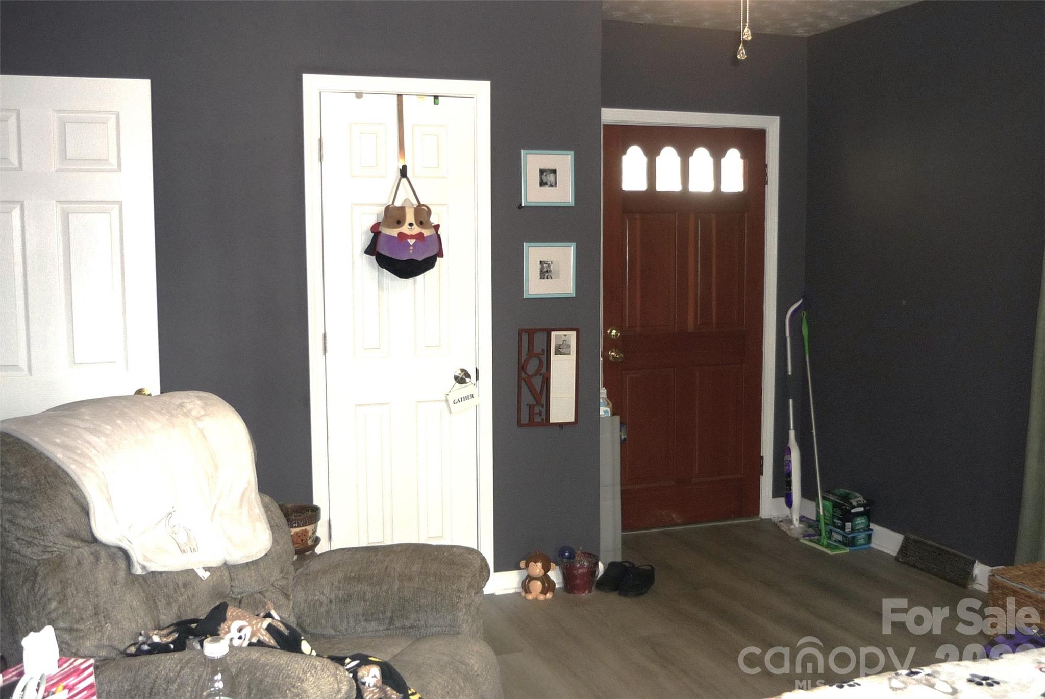 120 Bradley Road Shelby, NC 28152 - Photo 33 of 41 a bedroom with a bed and a chandelier