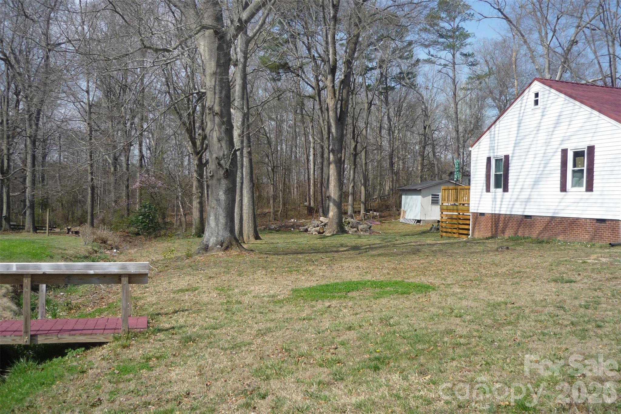 120 Bradley Road Shelby, NC 28152 - Photo 5 of 41 a view of backyard with table and chairs and wooden fence
