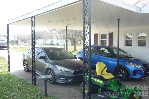 a living room filled with furniture and a floor to ceiling window